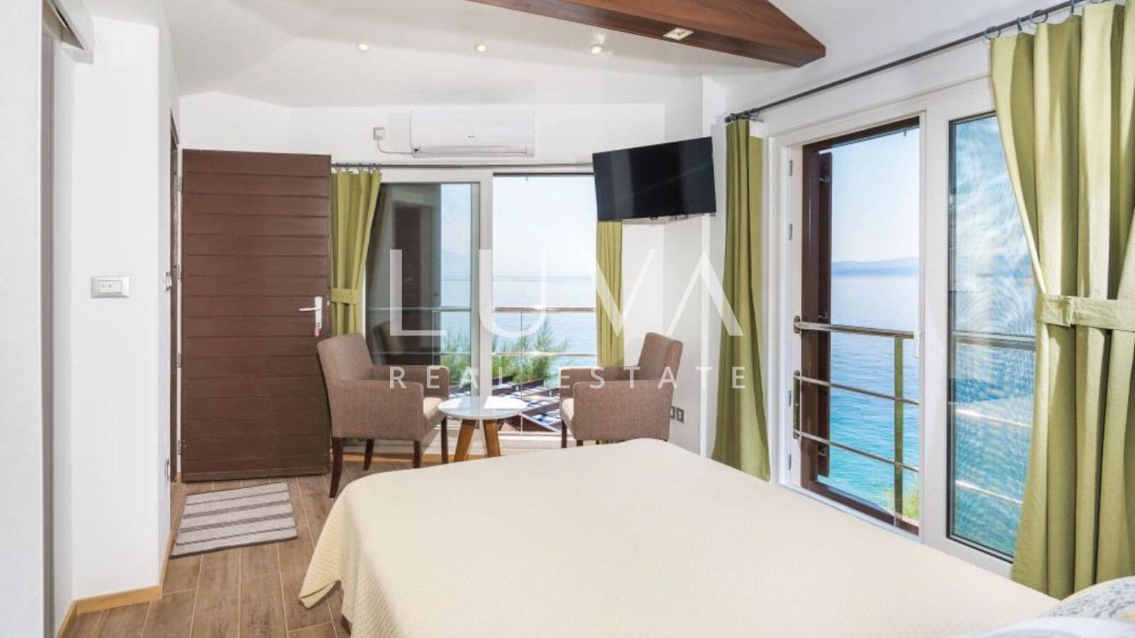 Omiš, Stanići, seafront house with pool for sale