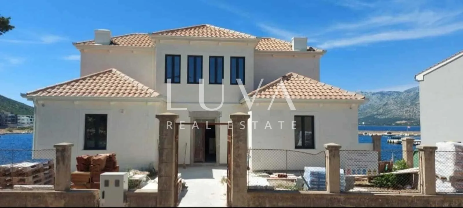 Zadar, Vinjerac, three-storey stone house by the sea for sale